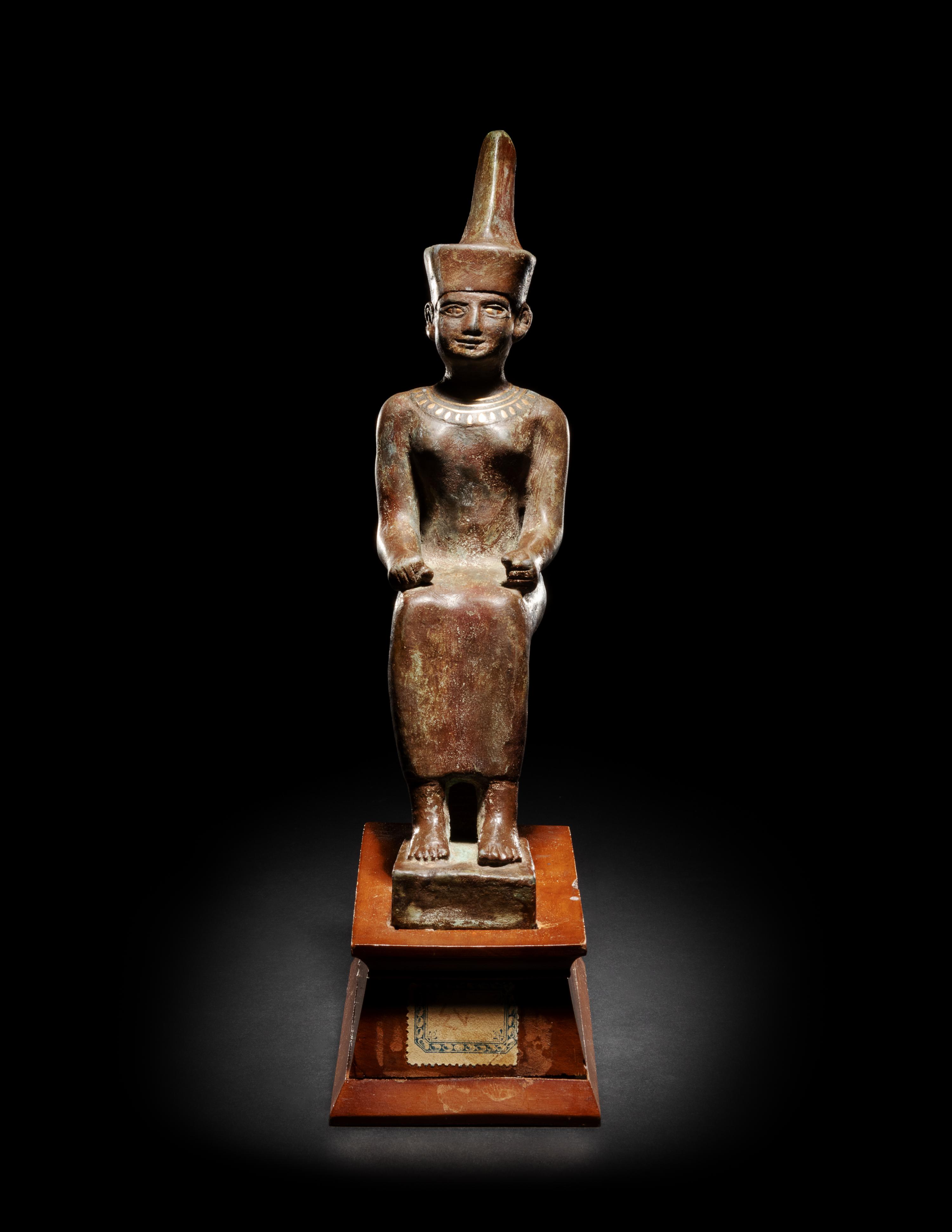 An Egyptian Gold Inlaid Bronze Seated Neith