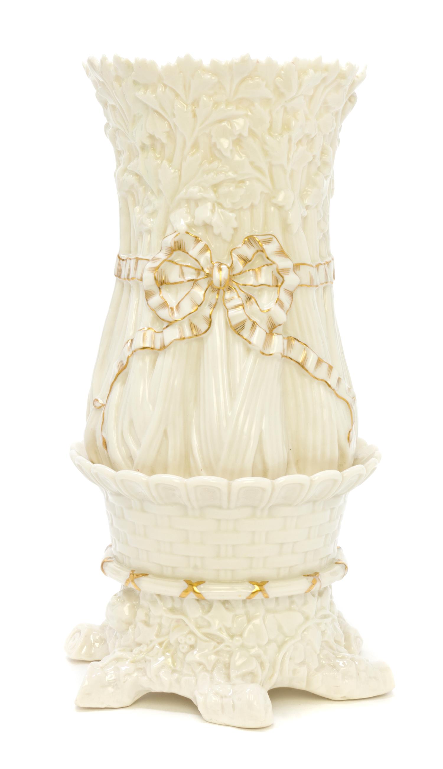 A Belleek Celery Vase, Height 15 inches.