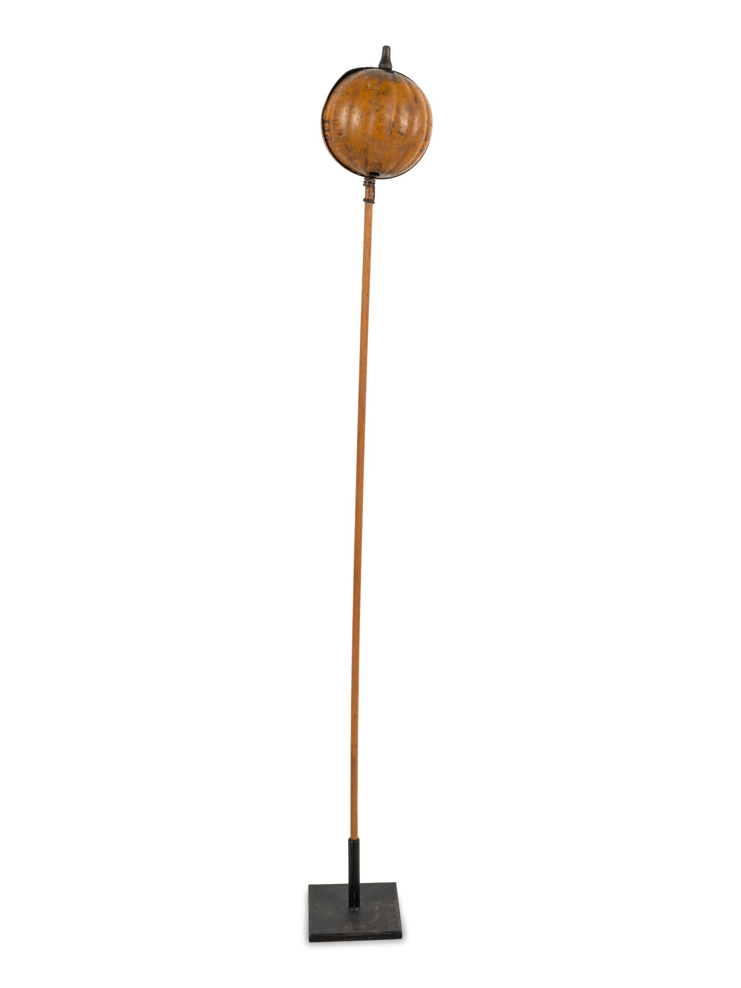 A Painted Tin Jack O' Lantern Ornament