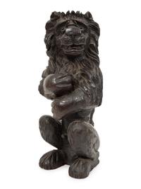 An English Carved and Stained Oak Figure of a Lion