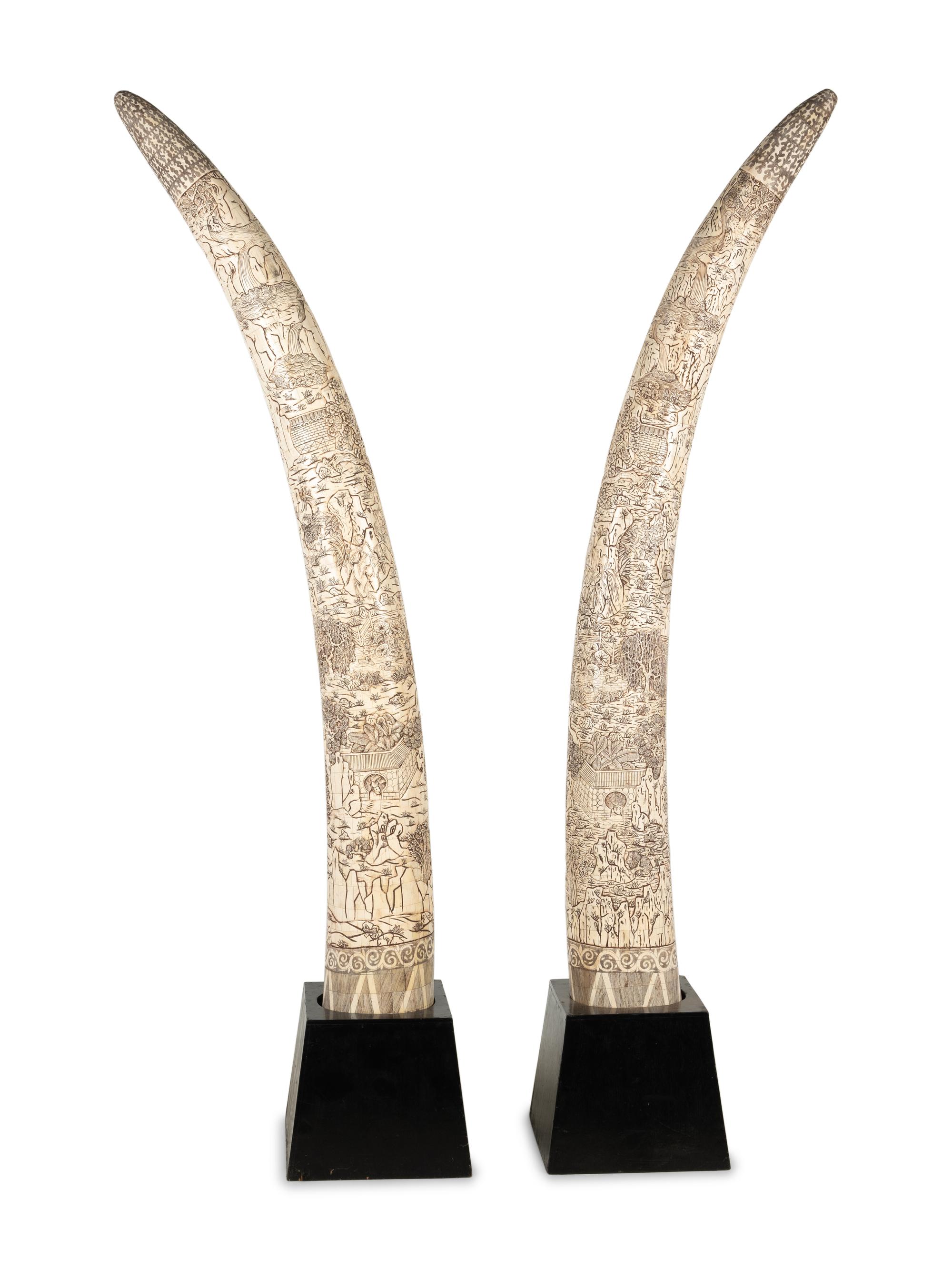 A Pair of Large Carved Bone Veneered Models of Tusks