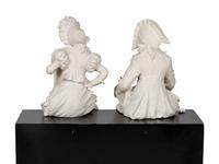 A Pair of Composition or Resin "Column Sitter" Figures