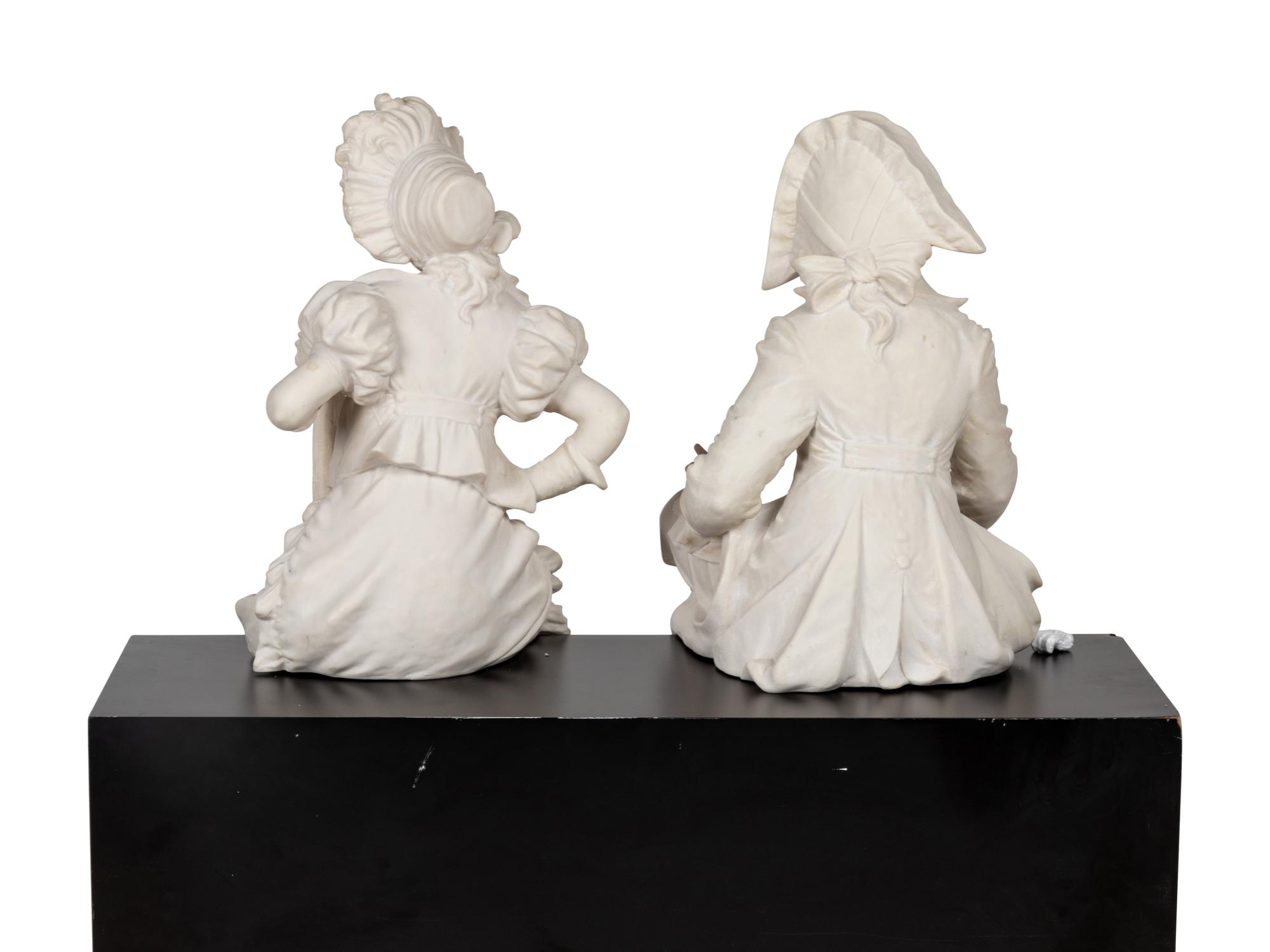 A Pair of Composition or Resin "Column Sitter" Figures