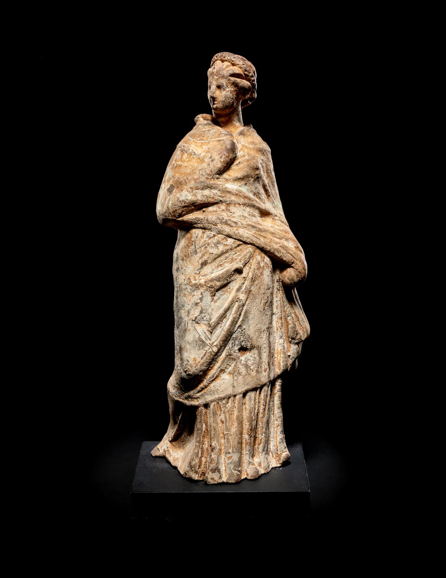 A Greek Terra Cotta Draped Female Figure