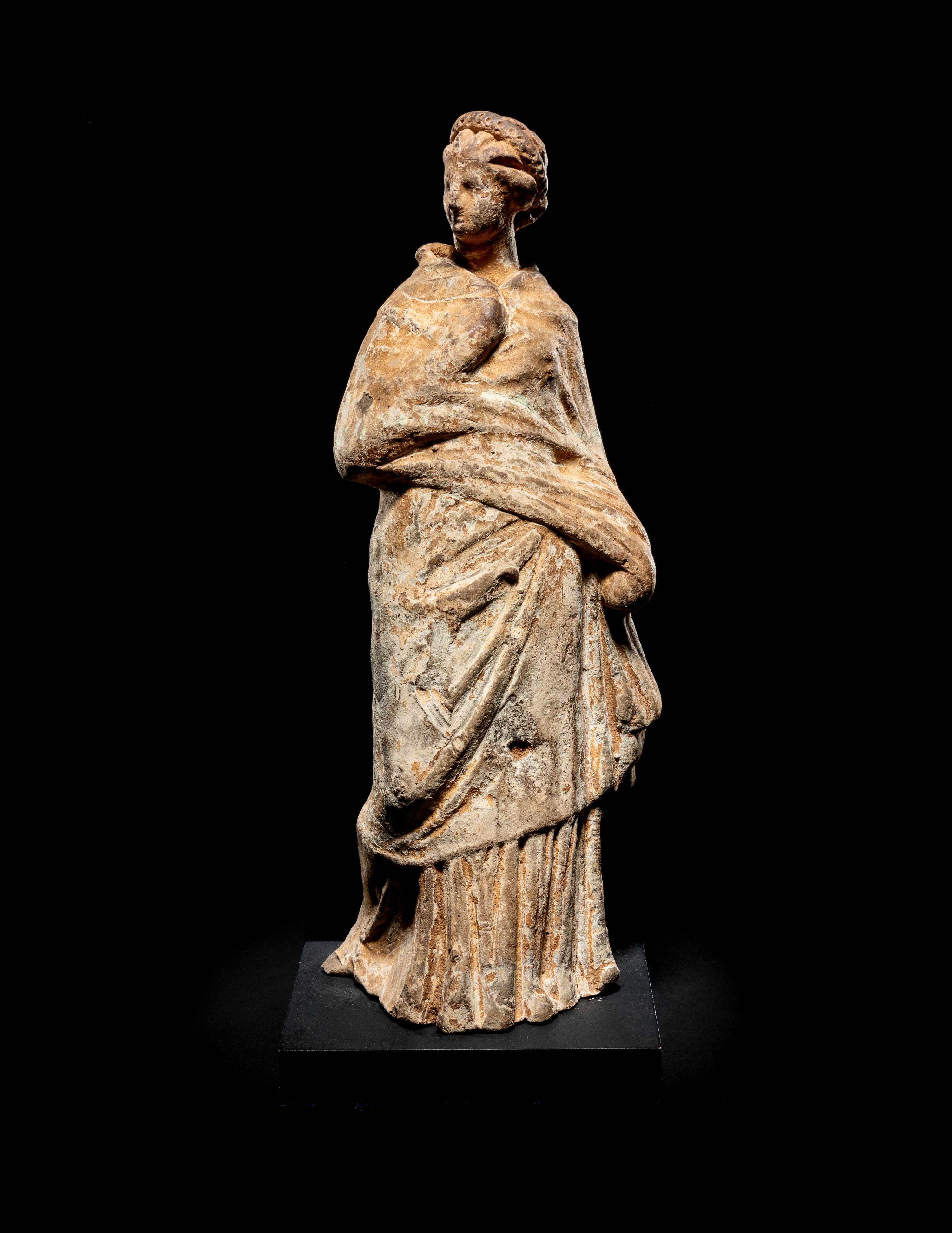 A Greek Terra Cotta Draped Female Figure