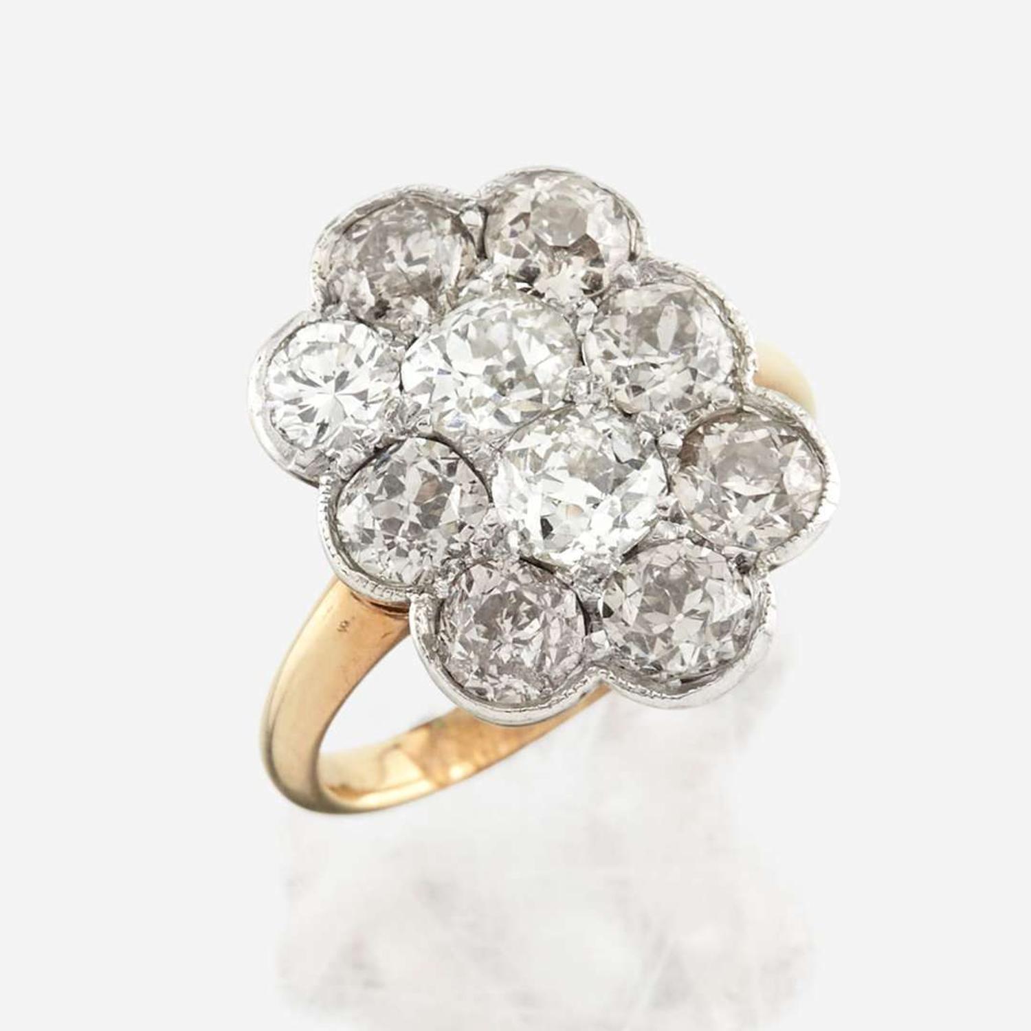 A diamond and platinum topped gold ring