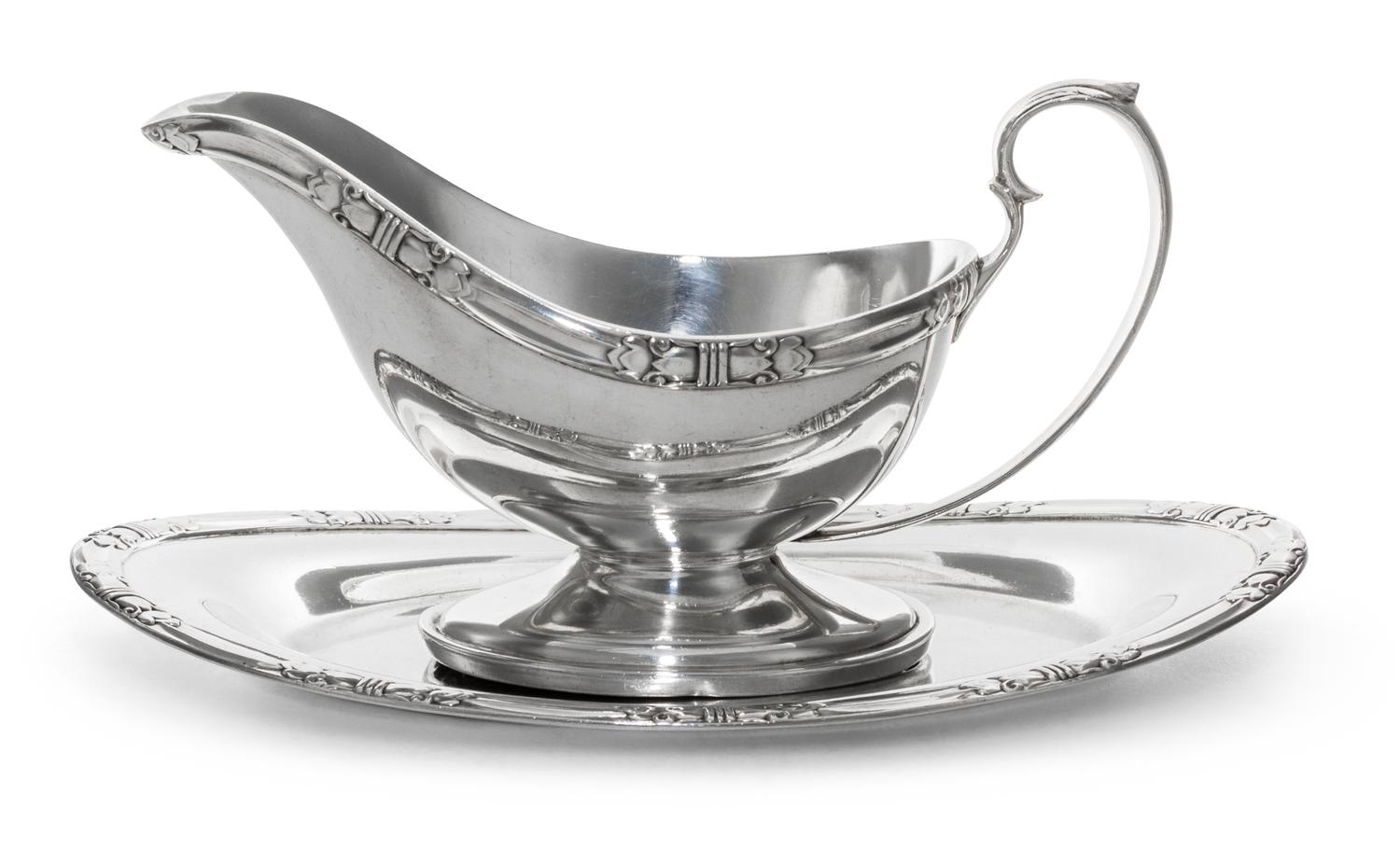 An American Silver Sauce Boat and Underplate, Manchester Silver Co., Providence, RI, 20th Century, of oval form with a banded edge.