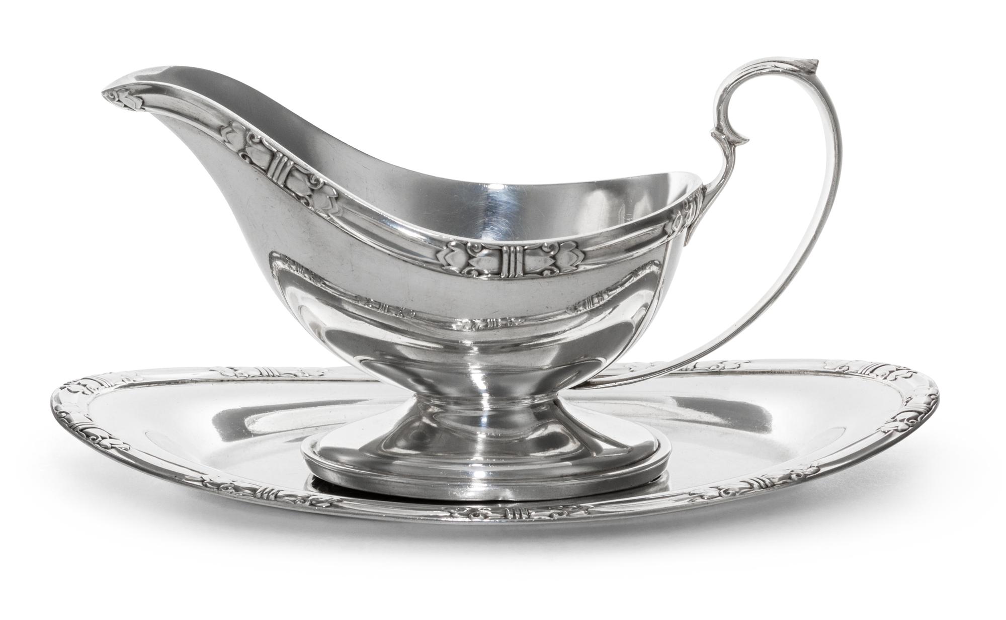 An American Silver Sauce Boat and Underplate, Manchester Silver Co., Providence, RI, 20th Century, of oval form with a banded edge.
