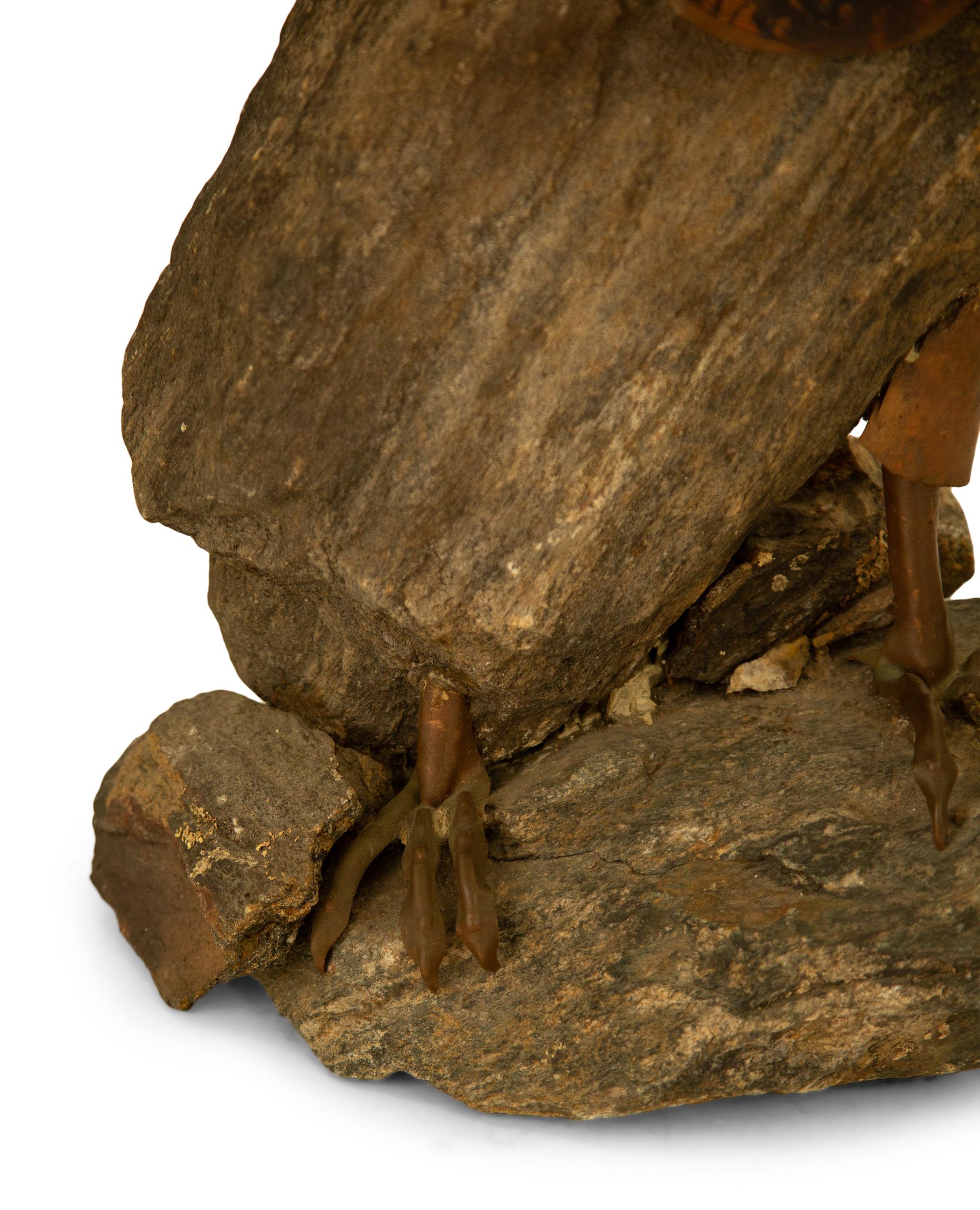 A Natural Stone and Patinated Bronze Figure of an Eagle