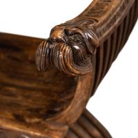 A Pair of Italian Carved Walnut Savonarola Chairs