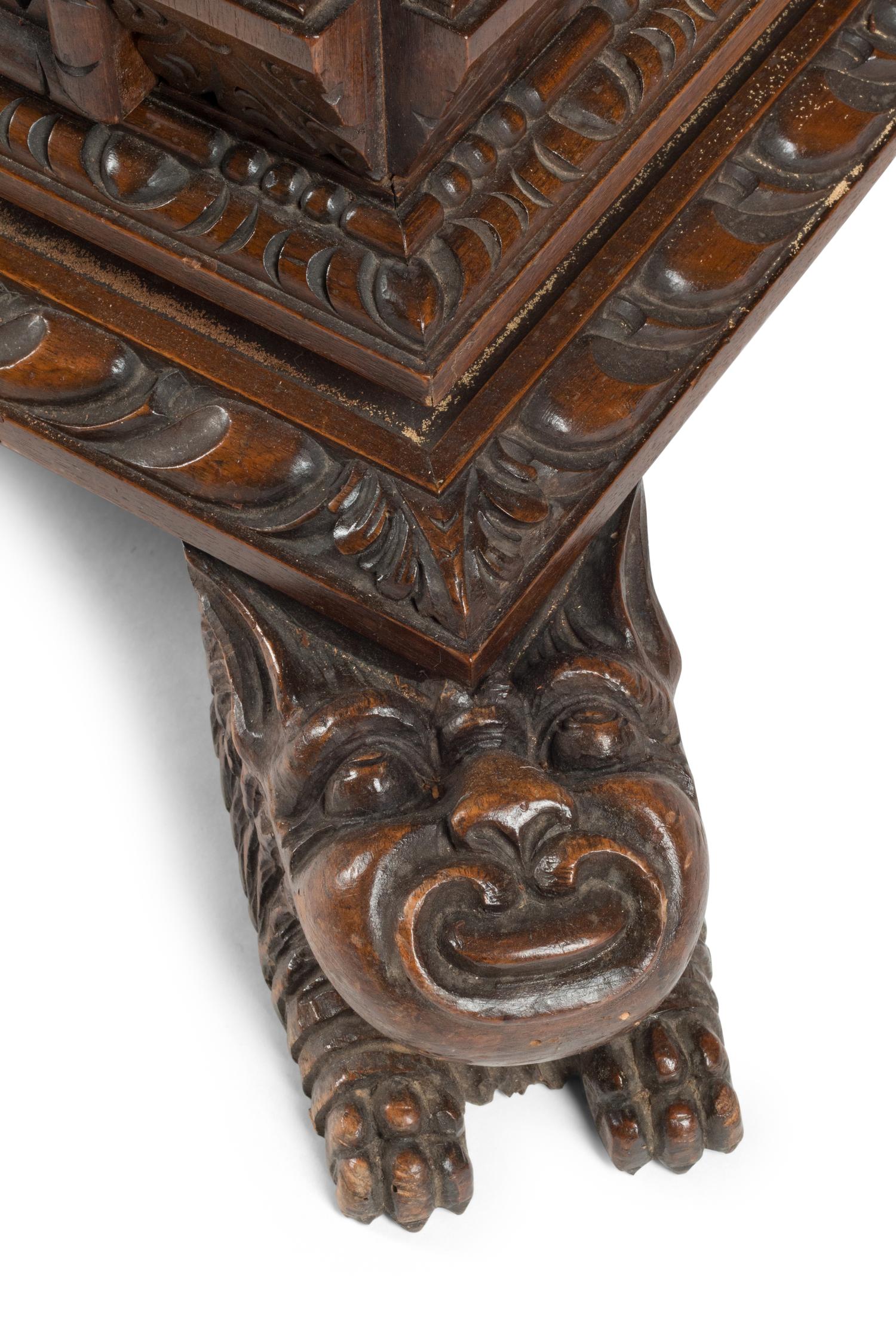 An Italian Renaissance Revival Carved Walnut Chest of Drawers