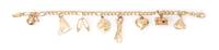 A 14 Karat Yellow Gold Charm Bracelet with 8 Attached Charms, 7.00 dwts.