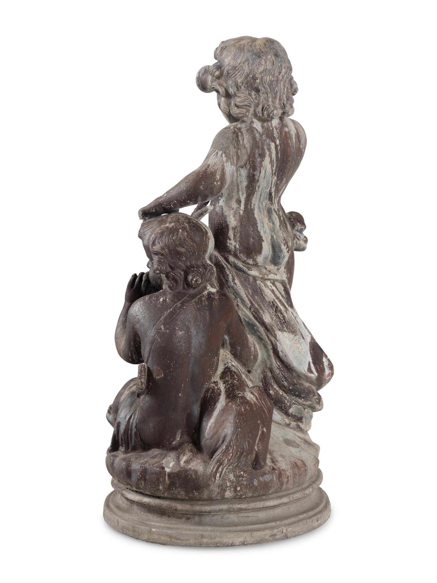 A Cast Lead Figural Group