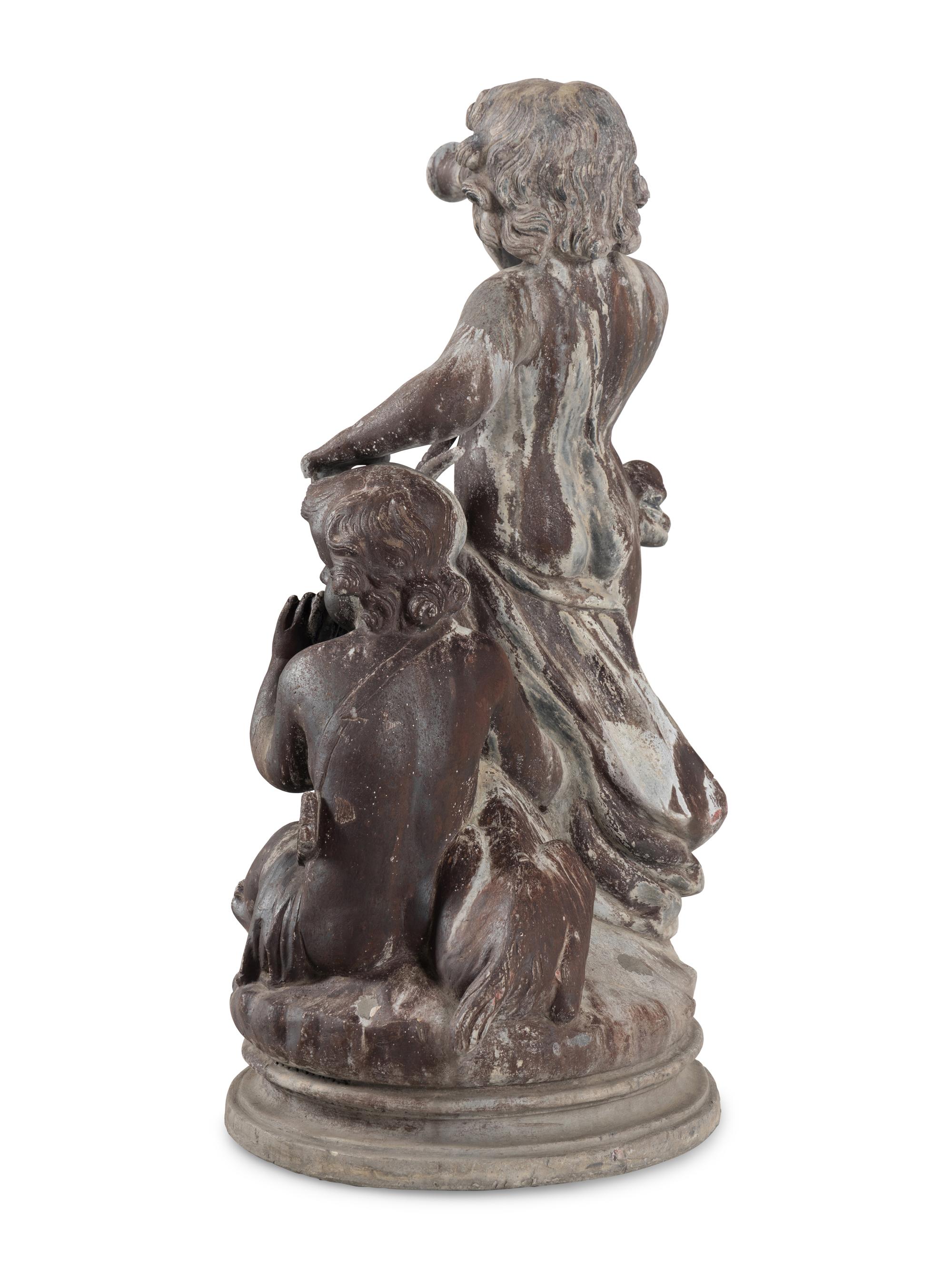 A Cast Lead Figural Group
