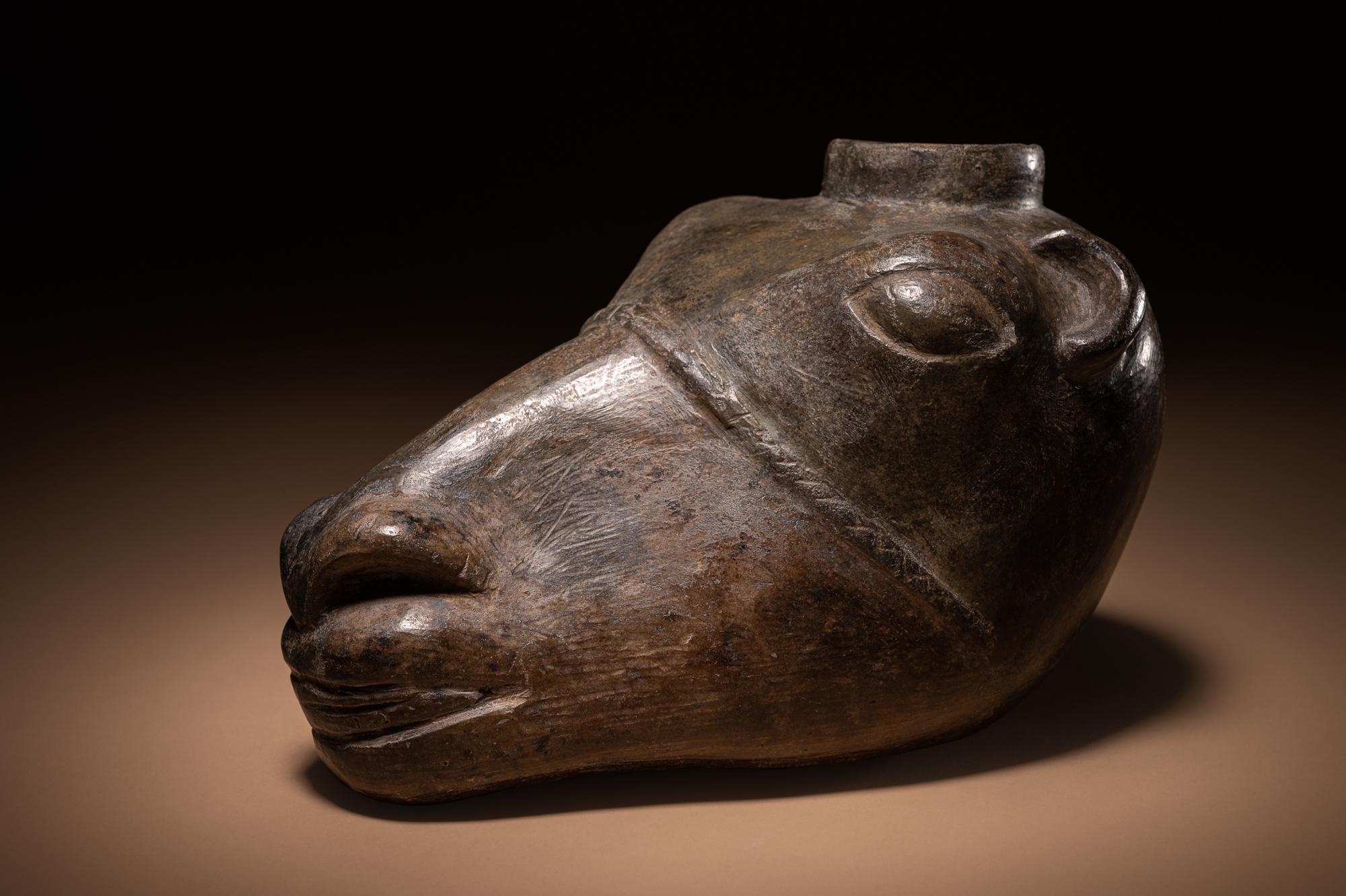 A Chimu Blackware Llama Head