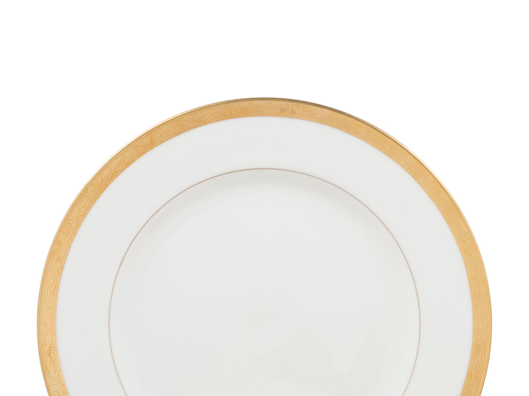 An Assembled Collection of Gilt-Edged Porcelain Dinnerware