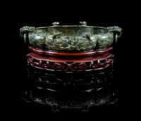 A Large Chinese Spinach Jade Marriage Bowl EARLY 20TH CENTURY Length 13 1/4 inches. — EARLY 20TH CENTURY