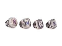 A Group of Four Northwestern University Football and Basketball Championship Rings,