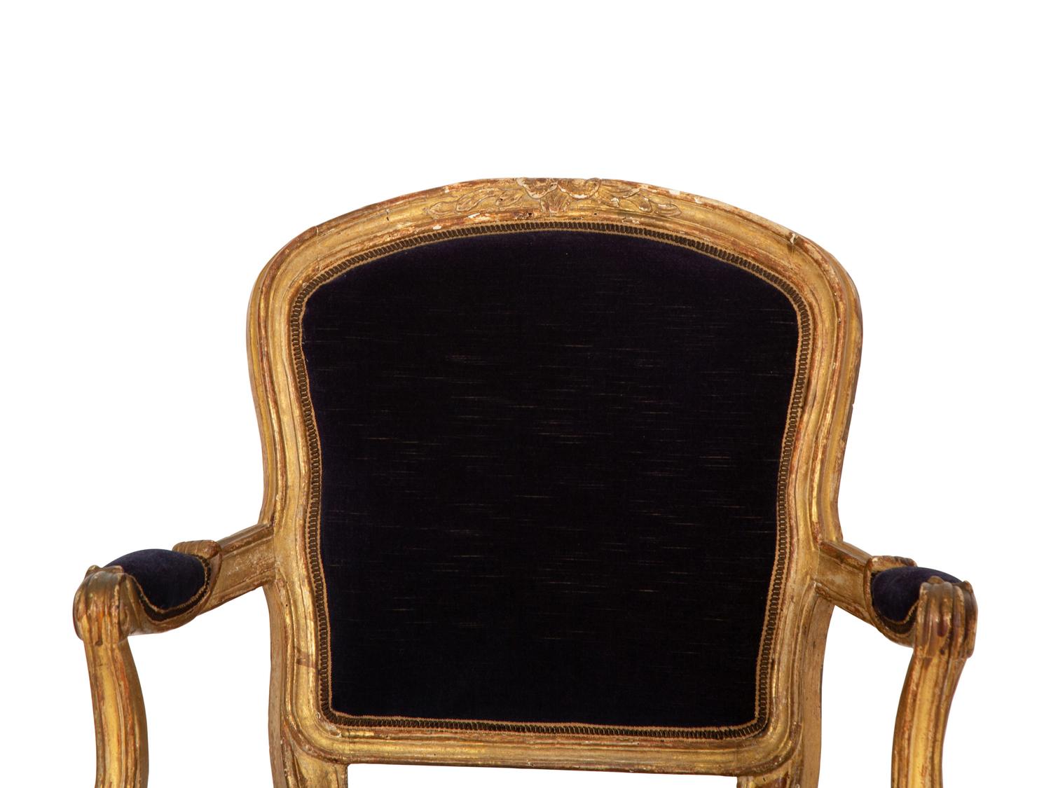 A Pair of Louis XV Giltwood Fauteuils