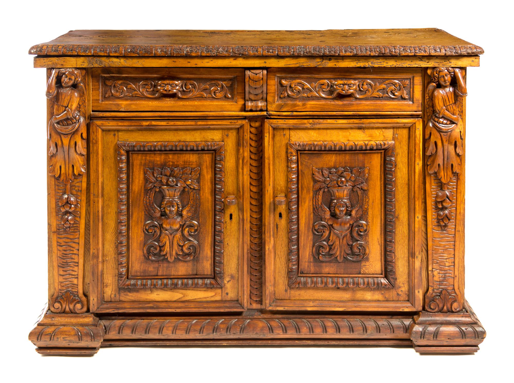 An Italian Renaissance Style Walnut Cabinet Height 38 1/2 x width 55 1/2 x depth 22 5/8 inches. — INCORPORATING 16TH CENTURY ELEMENTS