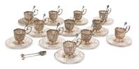 A Set of Twelve Continental .800 Silver Demitasse Cup Holders with Undertrays, , having pierced floral and bird decorated borders and c