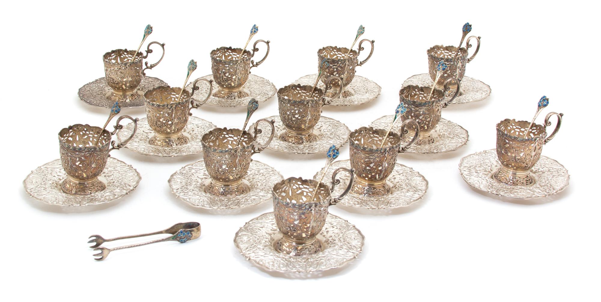 A Set of Twelve Continental .800 Silver Demitasse Cup Holders with Undertrays, , having pierced floral and bird decorated borders and c