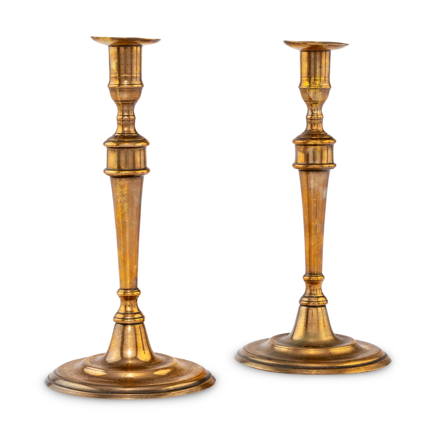 A Pair of George III Bell Metal Candlesticks