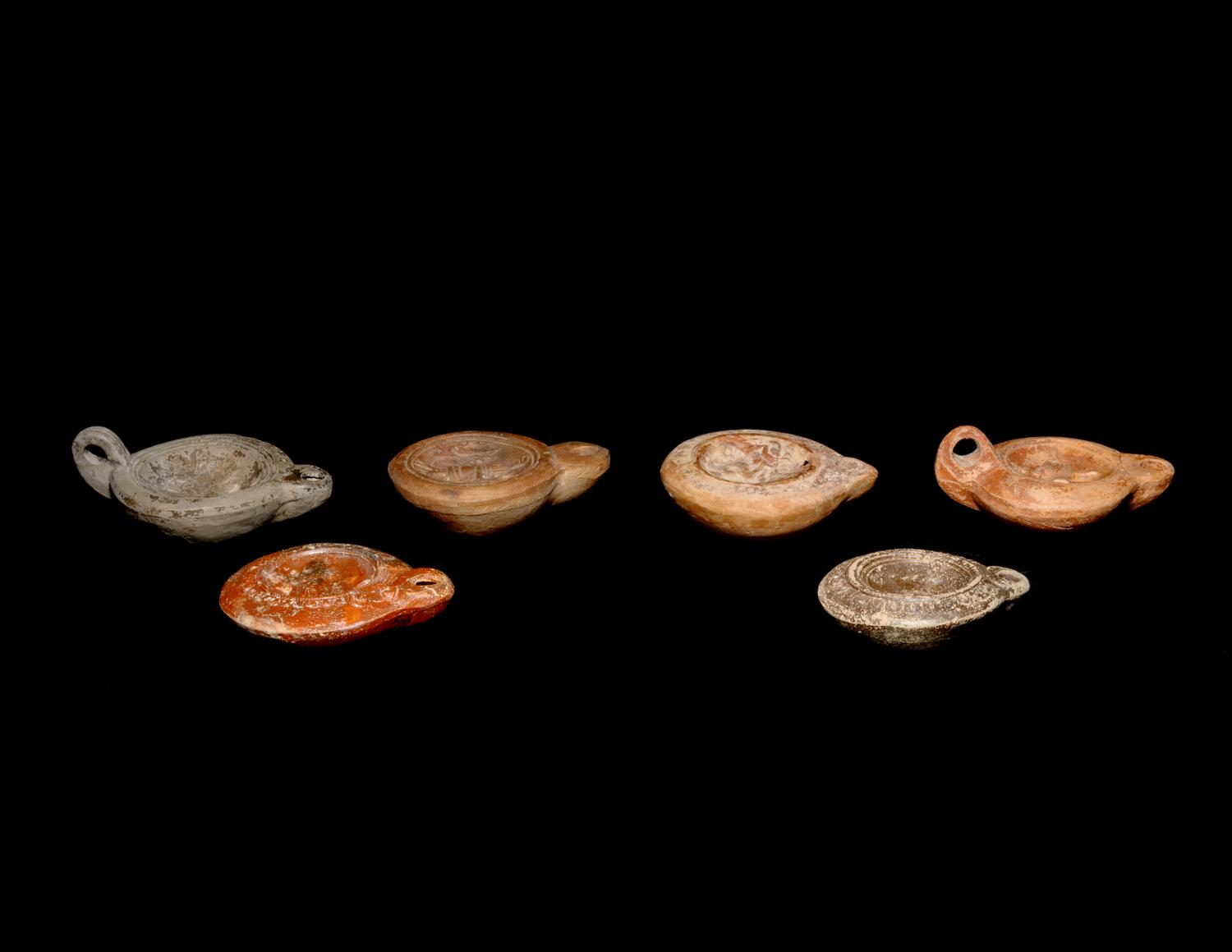 Six Roman Molded Terra Cotta Oil Lamps