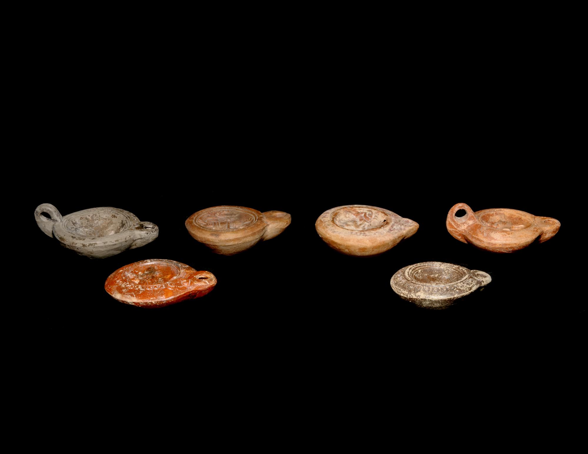 Six Roman Molded Terra Cotta Oil Lamps