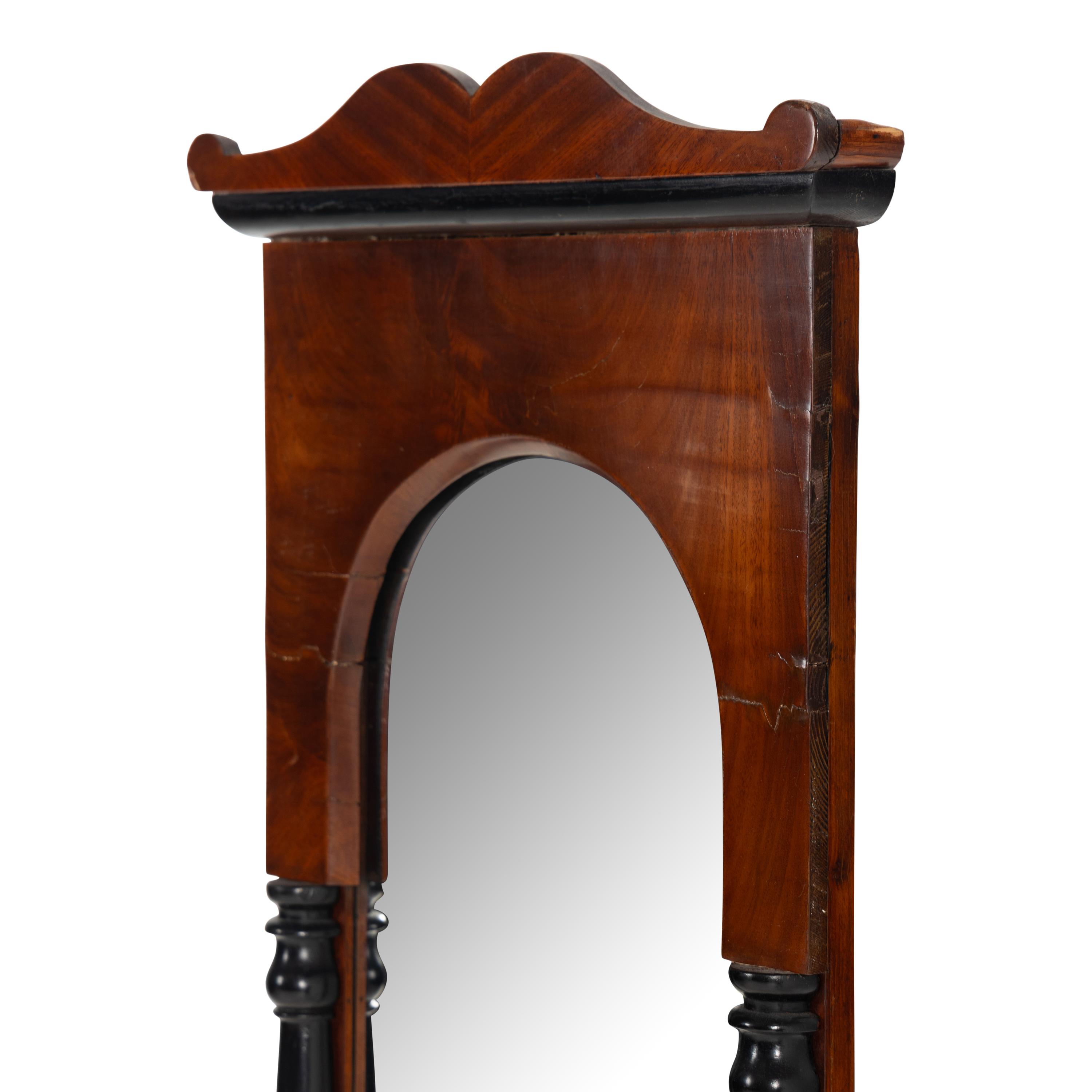 An Austrian Neoclassical Mahogany and Part Ebonized Mirror