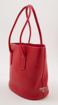 A Prada Red Leather Perforated Tote Bag, 11" x 9" x 3.5"; Handle drop: 7.5".