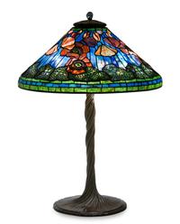 A Tiffany Studios Blue Favrile Glass and Bronze Elaborate Poppy Table Lamp Diameter of shade 20 1/4 inches, height overall 27 1/2 inche