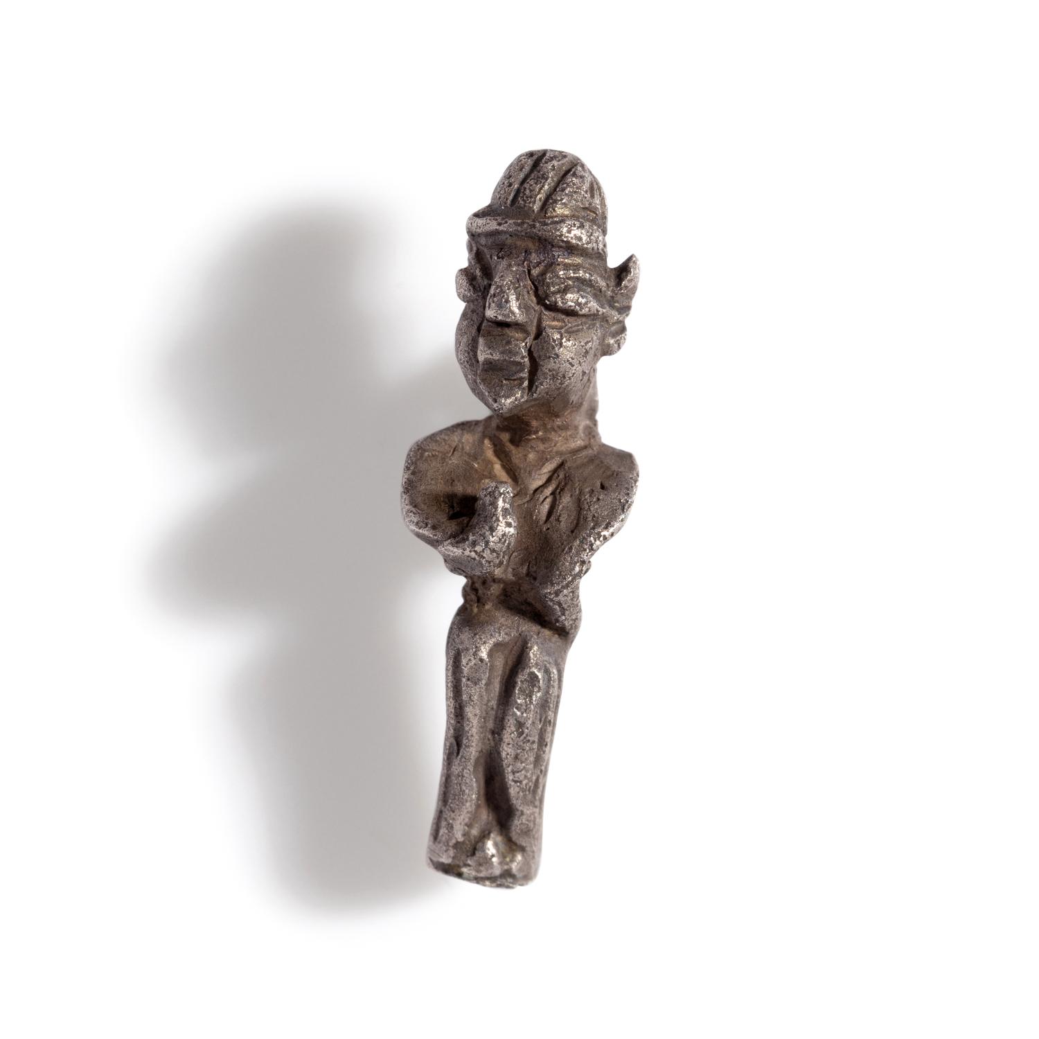 A Phoenician Silver Pendant of a Deity