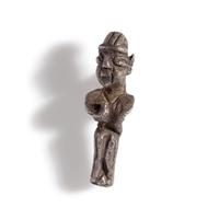 A Phoenician Silver Pendant of a Deity