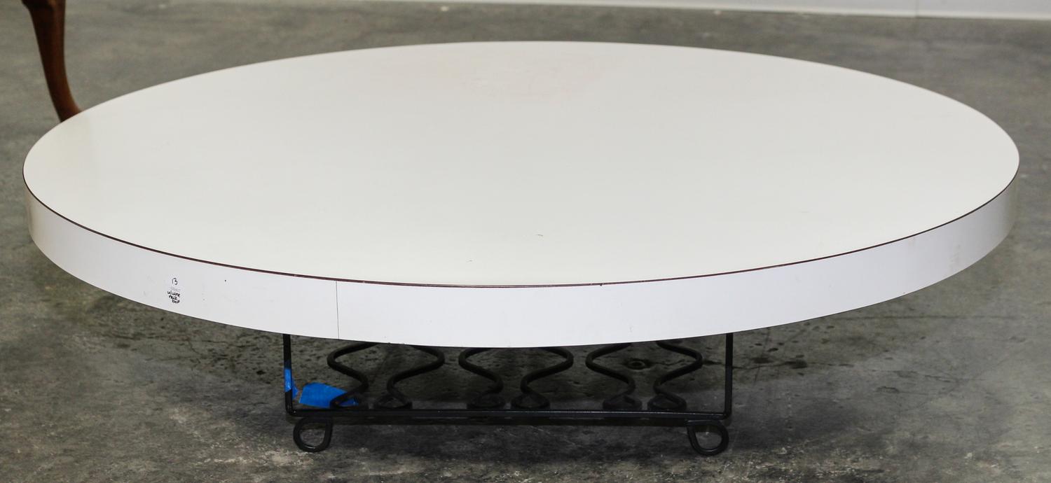 A Contemporary White Laminate and Iron Low Table Diameter 39 inches.
