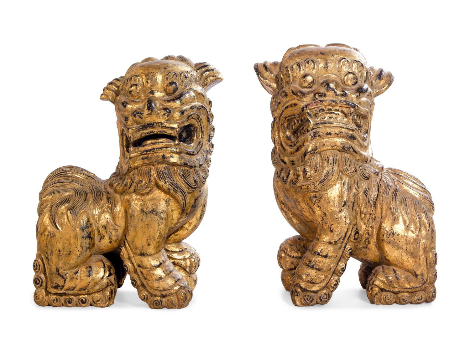 A Pair of Gilt Decorated Lion Figures