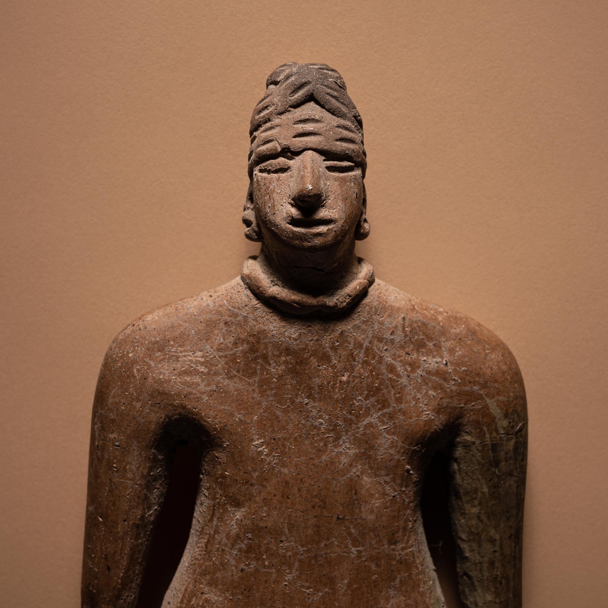 A Colima Standing Female Figure