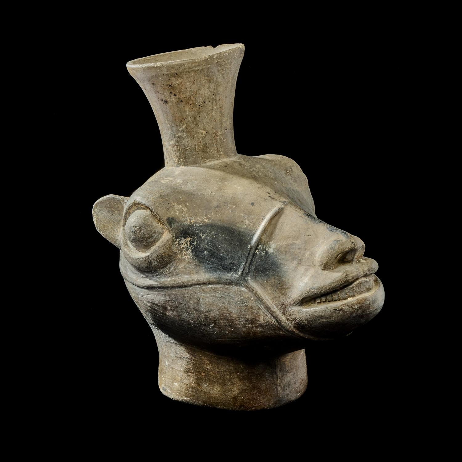 An Inca Terracotta Llama Head Vessel