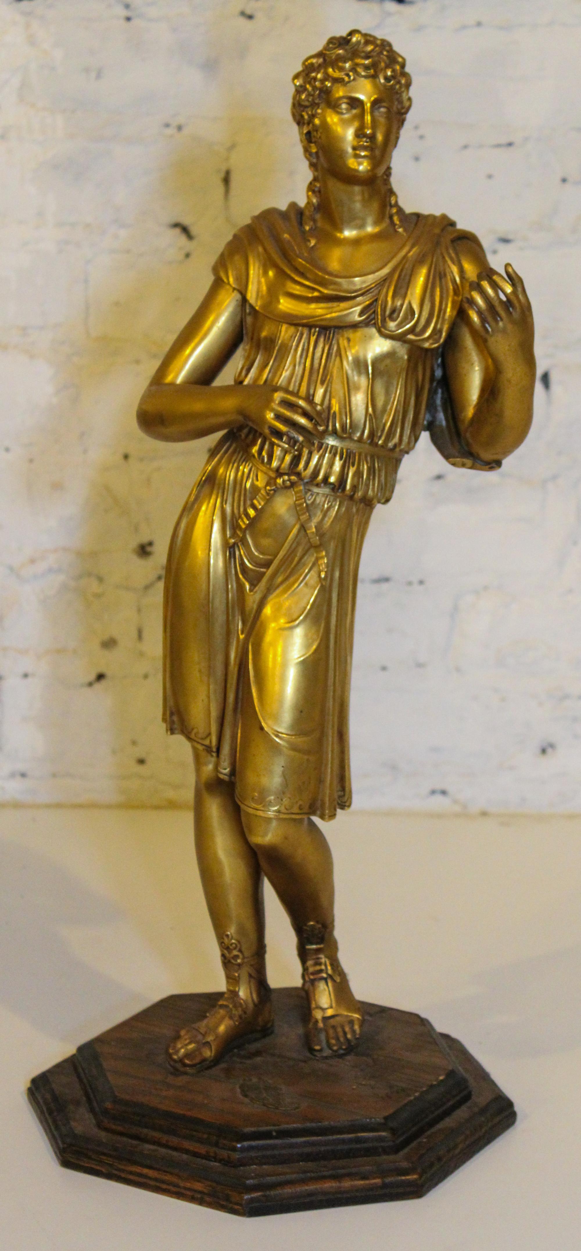 A Gilt Bronze Figure. Height 21 inches.