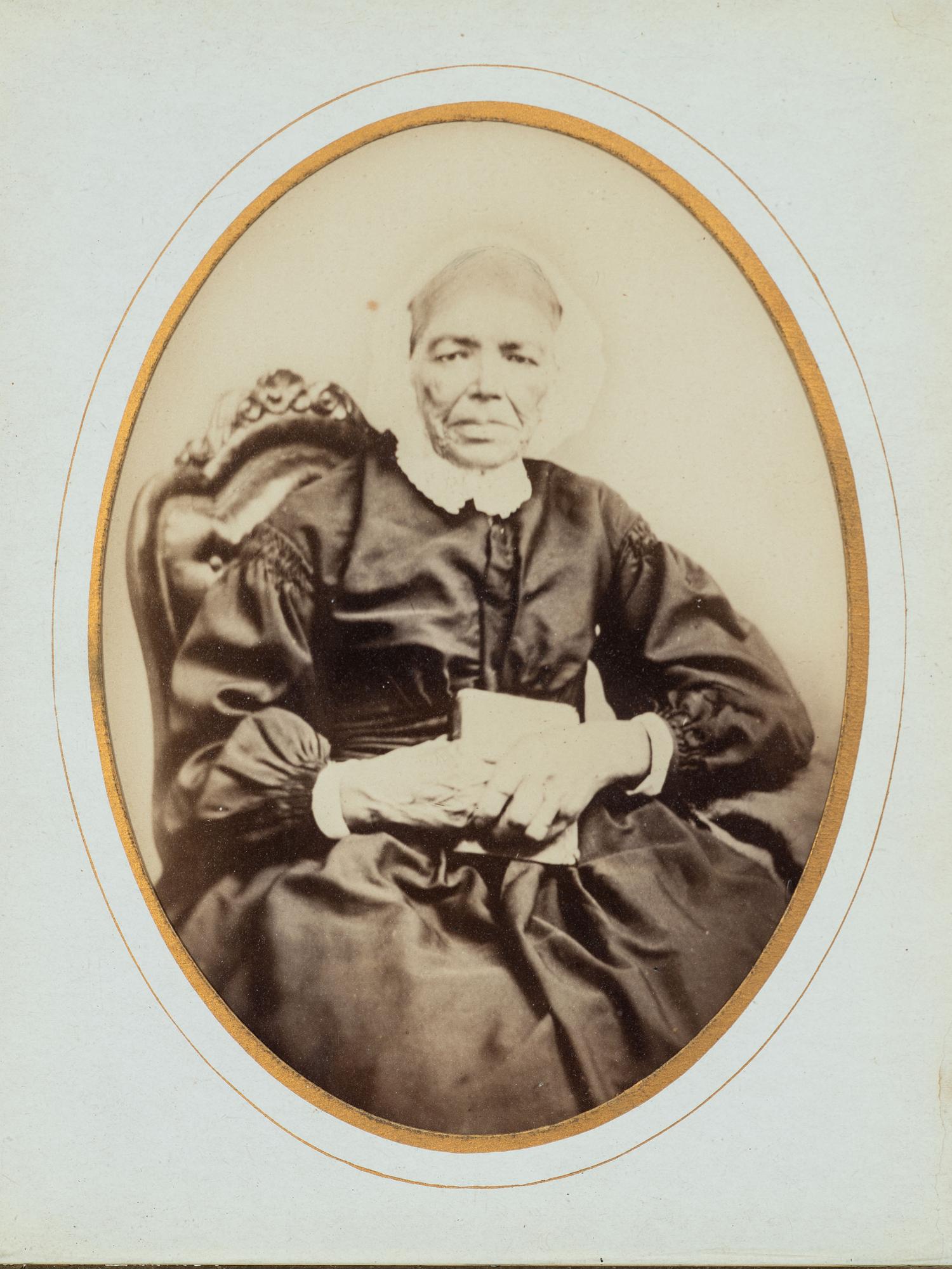 [EARLY PHOTOGRAPHY]. Albumen photograph of African American woman and tintype of white man found together in Louisiana. Ca mid 19th century.