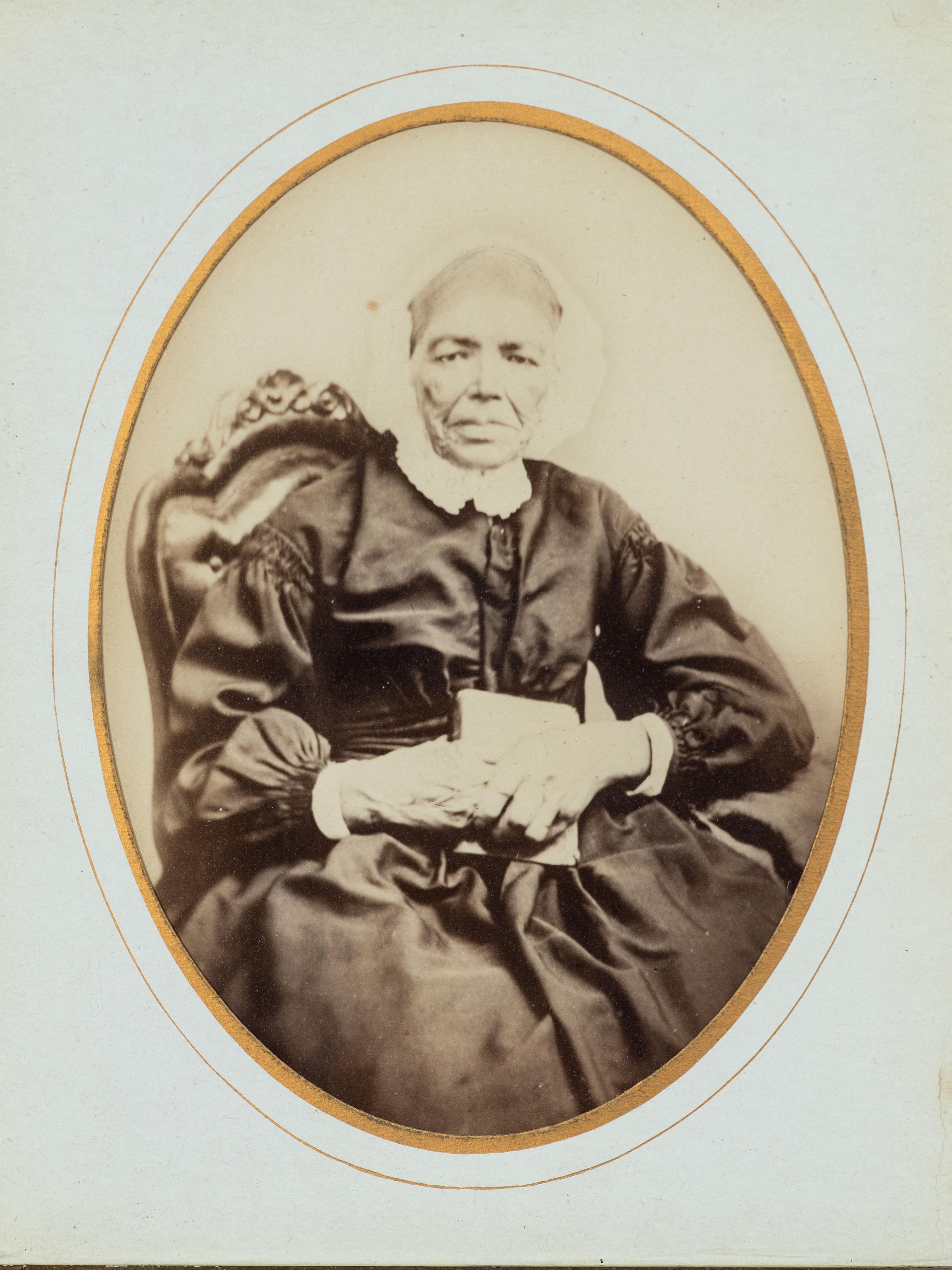 [EARLY PHOTOGRAPHY]. Albumen photograph of African American woman and tintype of white man found together in Louisiana. Ca mid 19th century.