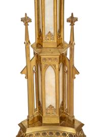 A Pair of Gothic Style Brass and Inset Glass Candlesticks
