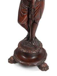 A Venetian Style Carved Walnut Figural Stand