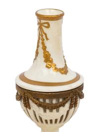A Neoclassical Gilt Metal Mounted Ceramic Table Garniture
