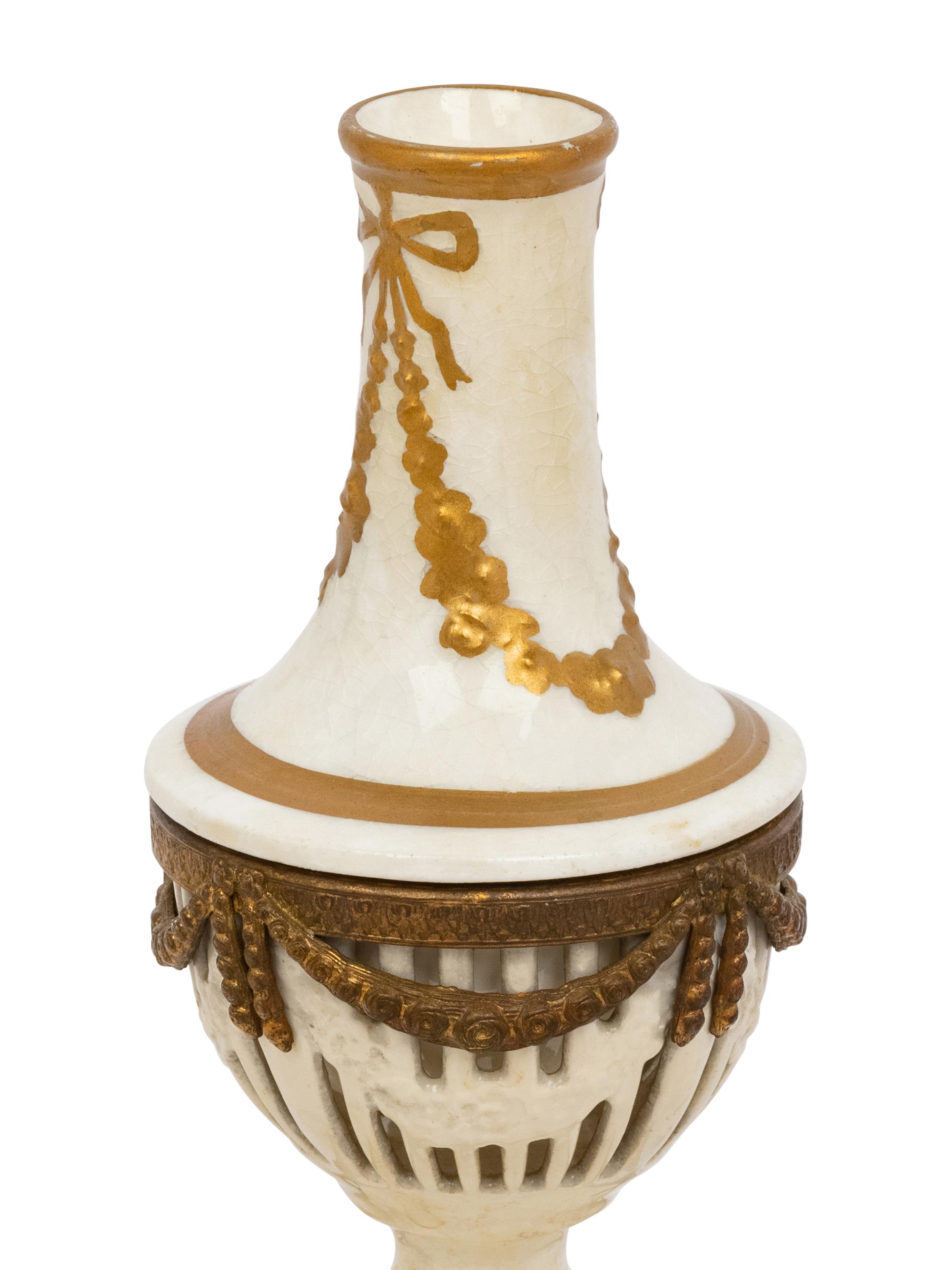 A Neoclassical Gilt Metal Mounted Ceramic Table Garniture