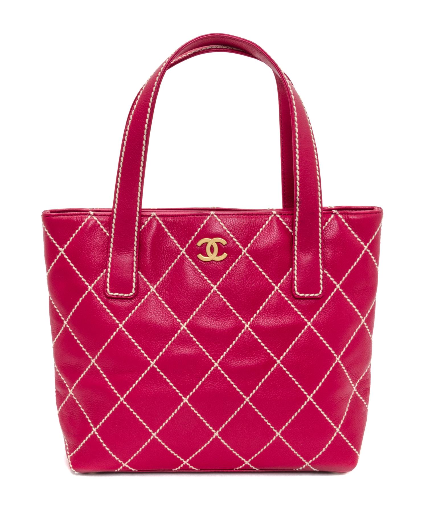 A Chanel Raspberry Caviar Leather Handbag, 12" x 9" x 3".
