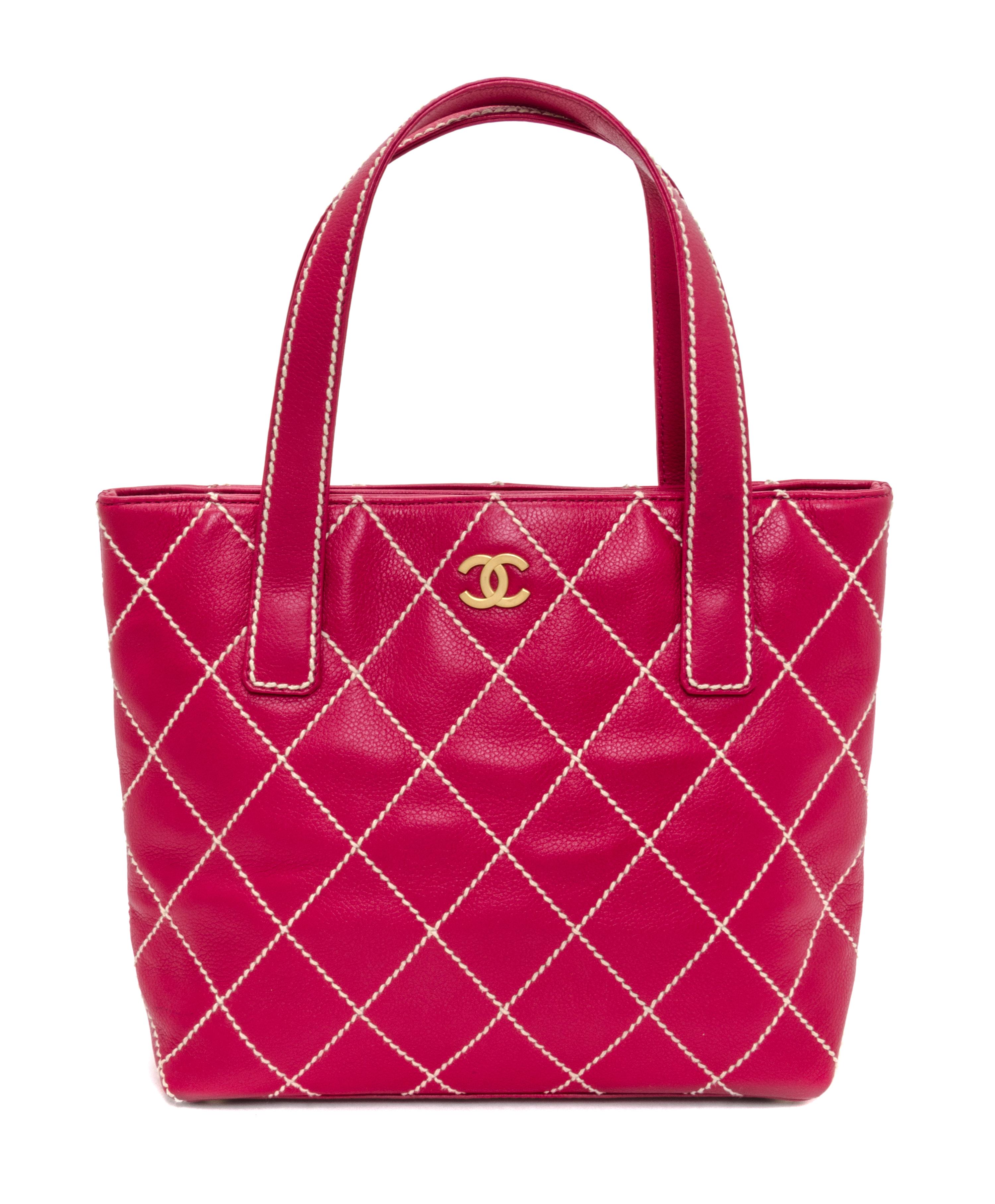 A Chanel Raspberry Caviar Leather Handbag, 12" x 9" x 3".