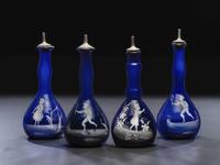 Four 'Mary Gregory' Cobalt Glass Barber Bottles