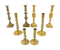 Four Pairs of English Brass Candlesticks
