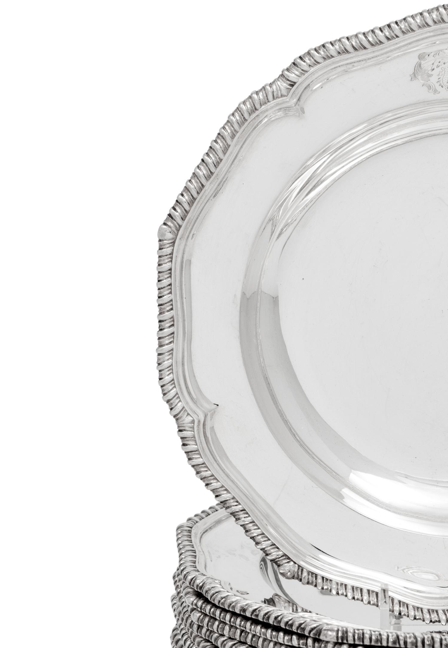 A Set of Twelve Silver Armorial Soup Plates